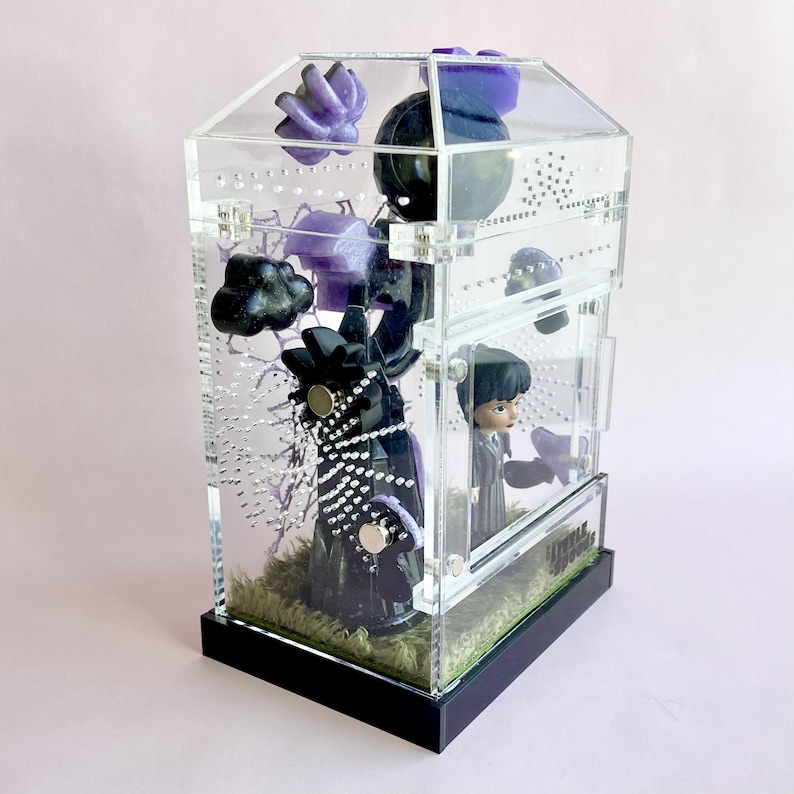 Opposite side view of Wednesday Addams themed jumping spider enclosure with magnetic décor.