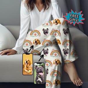 May include: White pajamas with a rainbow and dog print. The print features a dog's face with the name "Lucy" and "Pete" written below each dog. The text "#dogmom" is repeated throughout the print.