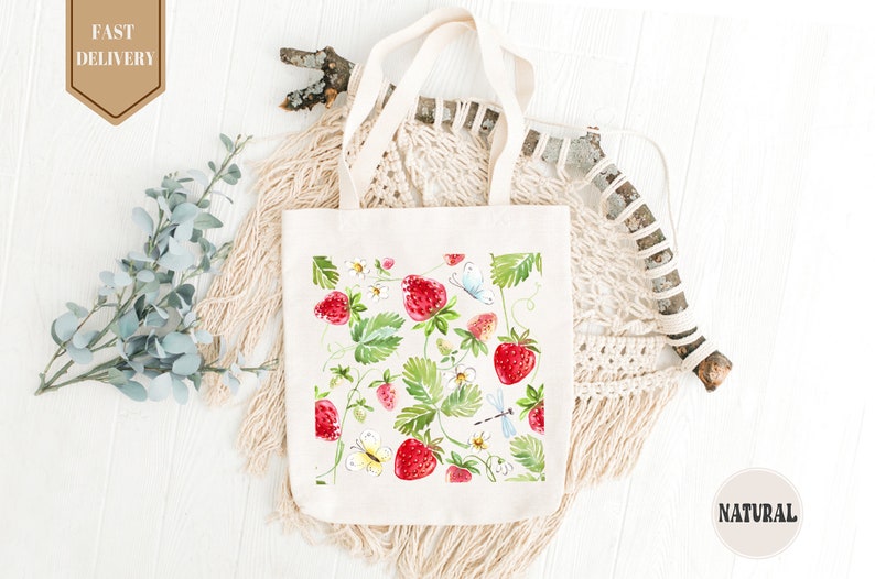 a white bag with strawberries and flowers on it