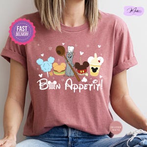 a woman wearing a t - shirt that says bon appetil