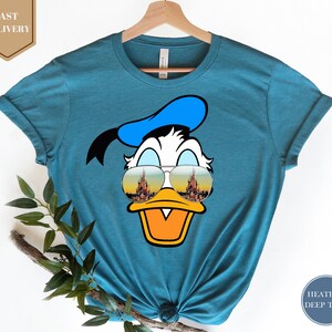 a t - shirt with a cartoon duck wearing sunglasses