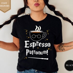 a woman wearing a black espresso patron shirt
