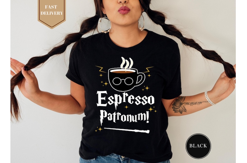 a woman wearing a black espresso patron shirt