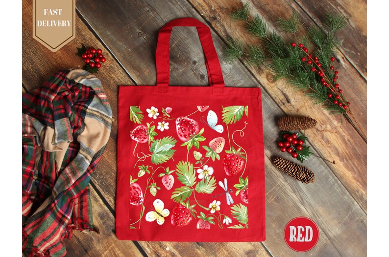 a red shopping bag sitting on top of a wooden floor