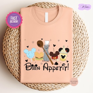 a pink t - shirt with a cartoon character on it