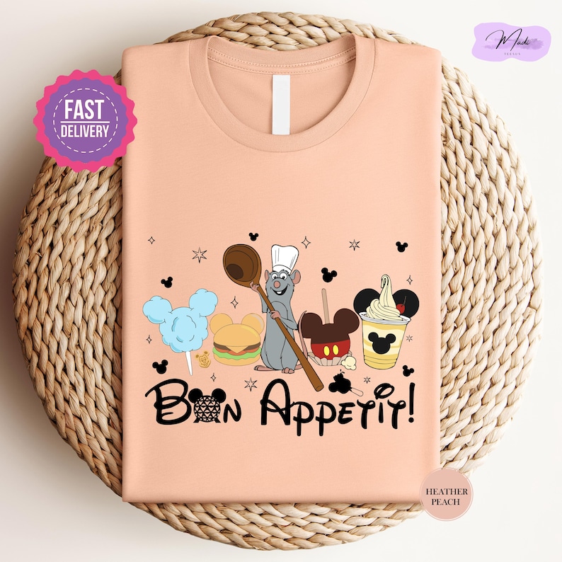 a pink t - shirt with a cartoon character on it