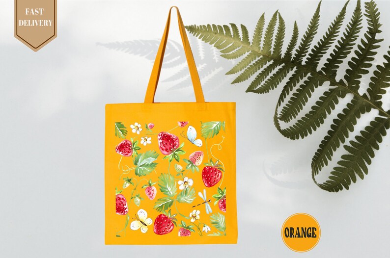 a yellow tote bag with flowers and leaves on it