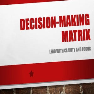 May include: A white poster with the words "DECISION-MAKING MATRIX" in bold red letters. Below, the text "LEAD WITH CLARITY AND FOCUS" is in gray. A red stripe with a star is at the bottom.