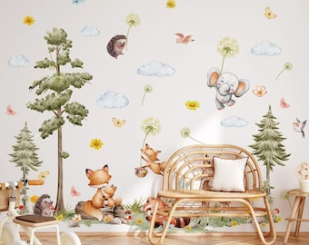 May include: A set of woodland animal wall decals featuring a fox family, a hedgehog, an elephant, a bird, and trees. The decals are perfect for adding a touch of whimsy to a nursery or child's room.