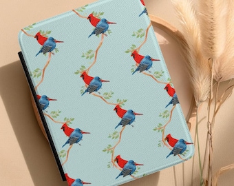 May include: A light blue tablet case featuring a repeating pattern of red and blue birds perched on branches with green leaves. The case has a black border and a textured surface.