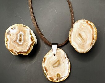 Polished Bahia River Agate pair, with matching raw edge pendant, cut from the same rock.