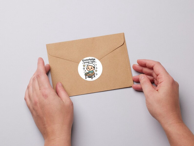 May include: A round sticker with a cartoon illustration of a person at a desk, with the text "Knowledge brings light." The sticker is on a brown envelope, held by two hands.