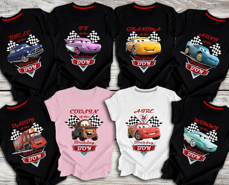 May include: Set of ten black, white and pink t-shirts with a Cars theme. Each shirt features a different character from the Cars movie, including Lightning McQueen, Mater and Tow Mater. The shirts also include the text "Birthday Boy" and the phrase "of the".