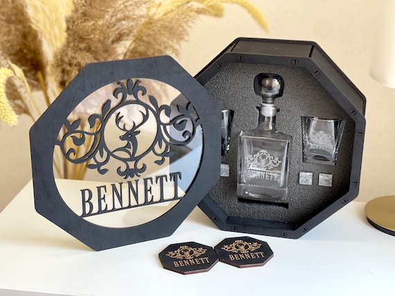 Full engraved whiskey decanter set with matching ice cube stones in a gift box — the complete package that actually looks impressive under a tree.