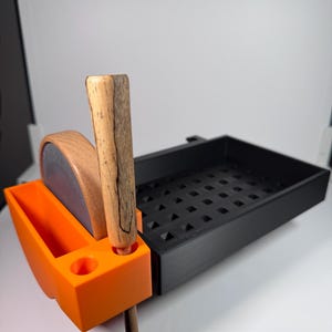 May include: A set of three ceramic mugs with a speckled, matte finish in cream, grey, and black. Each mug has a simple, modern design, suitable for coffee or tea. The mugs are stacked on top of each other.