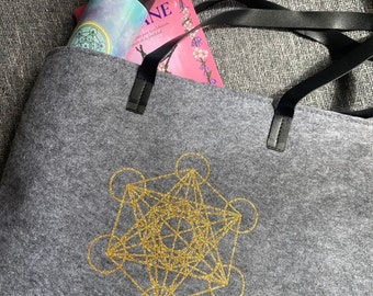 Tote bag y neceser metatron.