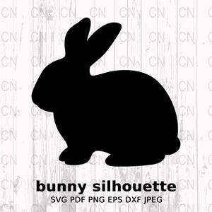 May include: A black bunny silhouette on a white wood-grain background. The bunny is in profile, with long ears and a rounded body. The text "bunny silhouette" is below the image, along with file type information.