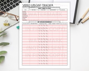 May include: A white paper with a pink grid layout titled "Video Upload Tracker" for tracking social media video performance. The document includes sections for upload dates, times, and performance metrics. A laptop, glasses, and pen are in the background.