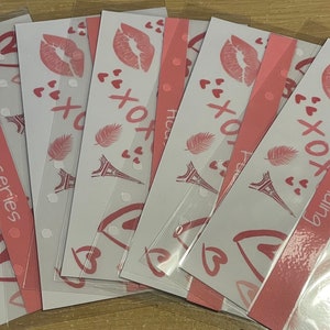 A pack of 5 a6 punched envelopes available in different colours