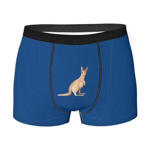 May include: Blue boxer briefs with a kangaroo illustration. The underwear features a black waistband and stitching details. The kangaroo is light brown and is centered on the front of the briefs.