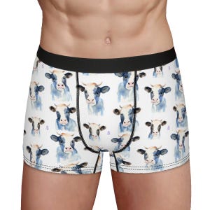 May include: White boxer briefs with a repeating pattern of watercolor cow faces.