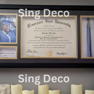 May include: A black framed diploma shadow box with a gold mat. The diploma is from Tennessee State University and is for Eyesha Brooks. The diploma is for a Bachelor of Business Administration. The shadow box also includes a photo of the graduate and a graduation tassel.