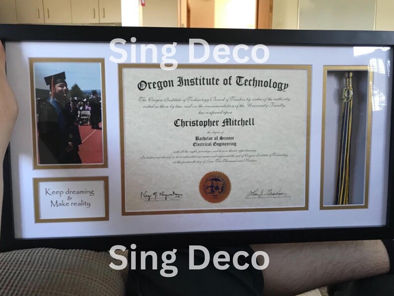 May include: A black framed diploma with a gold tassel, a photo of a person in a graduation cap and gown, and the text "Oregon Institute of Technology" and "Christopher Mitchell" in a white frame. The text below the photo reads "Keep dreaming & Make reality".