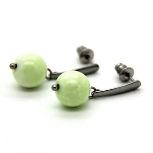 Lemon chrysoprase stainless steel plugs in pastel green in a hanging shape