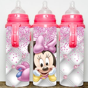 May include: Three pink and white baby bottles with a Minnie Mouse design. The bottles have a handle and a clear silicone nipple.