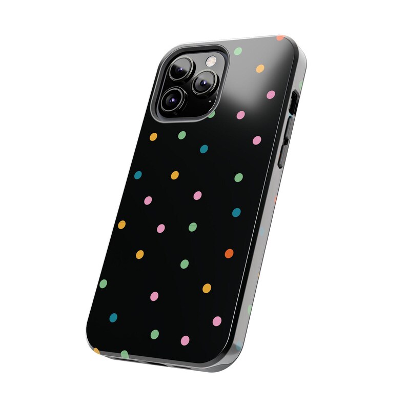 May include: A black phone case with a colourful polka dot pattern. The case has a clear, protective layer over the back and sides.