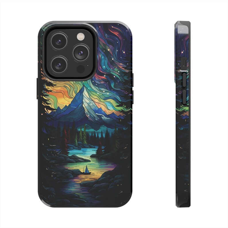 May include: A black phone case with a colorful stained glass design of a mountain range, a lake, and a boat. The design features a starry sky with a rainbow of colors.