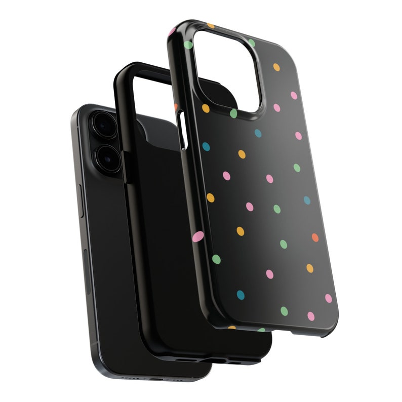 May include: A black phone case with a colourful polka dot pattern. The case is made of a hard plastic material and has a raised lip around the camera lens to protect it from scratches.