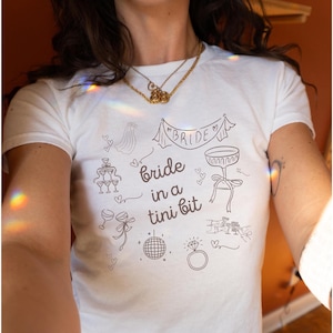 A Bride In A Tini Bit Baby Tee Espresso Martini Themed Bachelorette Party Martini Bride Baby Tee Espresso Martini Bachelorette Martini Bach