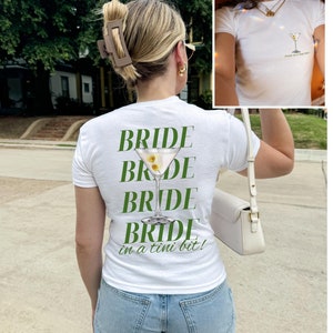 A Bride In A Tini Bit Baby Tee Dirty Martini Themed Bachelorette Party Dirty Martini Bride Baby Tee Dirty Martini Bachelorette Martini Bach