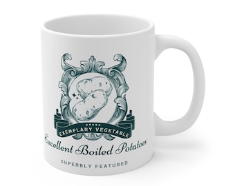 May include: White ceramic mug with a green and white design featuring a crest with two potatoes and the text "Exemplary Vegetable Excellent Boiled Potatoes Superbly Featured".