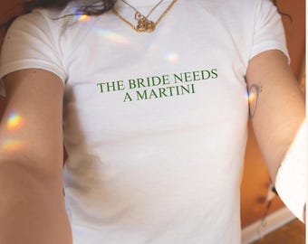 The Bride Needs A Martini Baby tee Martini Bachelorette Dirty Martini Bachelorette Party Bikinis and Martinis Weenies and Martinis Camp Bach