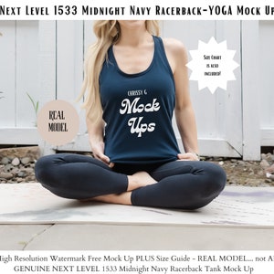 Puede incluir: Una mujer lleva una camiseta de tirantes de color azul marino con el texto "CHRISSY G Mock Ups" en blanco. Está sentada en una postura de yoga sobre una esterilla de yoga blanca.
