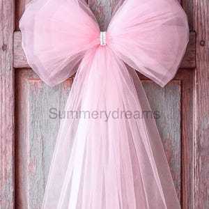 Lazos de cuento de hadas coquetos para colgar en la puerta de la pared