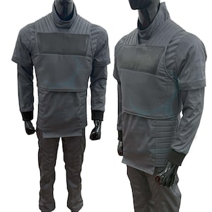 May include: A gray, long-sleeved shirt with a black vest and matching pants. The shirt has a high collar and a quilted design.