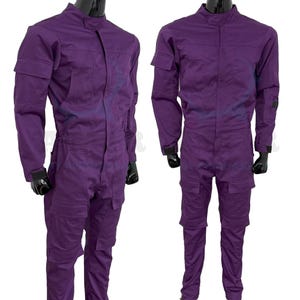 May include: A purple jumpsuit with long sleeves and a zip closure. The jumpsuit has pockets on the legs and chest.