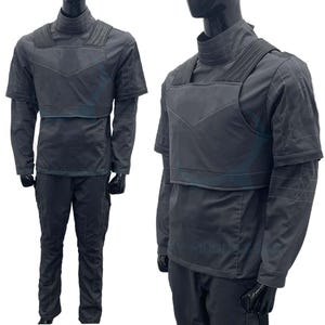 May include: A black and grey costume with a vest and trousers. The vest has a layered design and the trousers have cargo pockets.