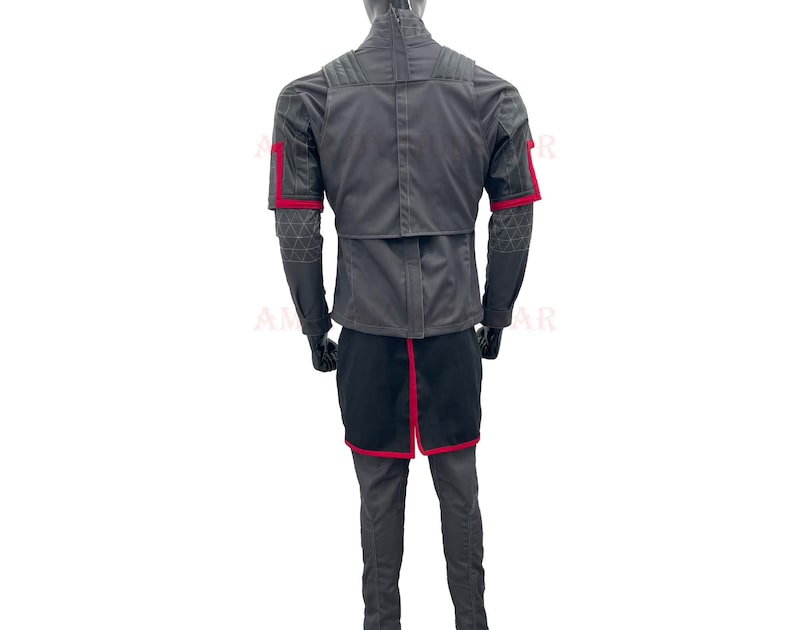 May include: A gray jacket with red accents on the sleeves and a black skirt. The jacket has a zipper closure and a stand-up collar.