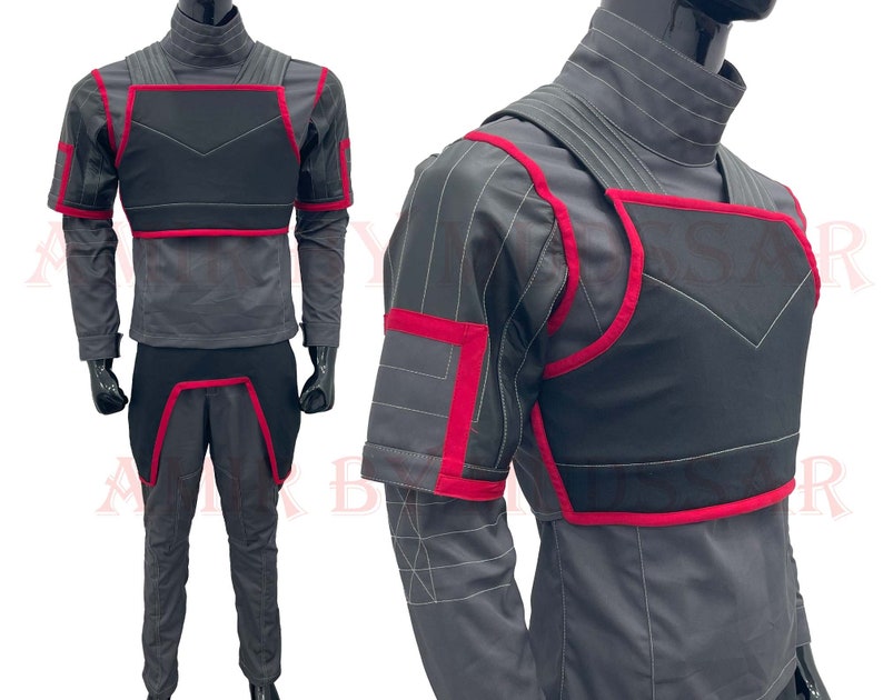 May include: A gray and black costume with red accents. The costume features a chest piece, shoulder pads, and pants.