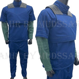 May include: A blue and gray jumpsuit with a high collar and short sleeves. The jumpsuit has a vest-like top with a zipper closure and a belt.