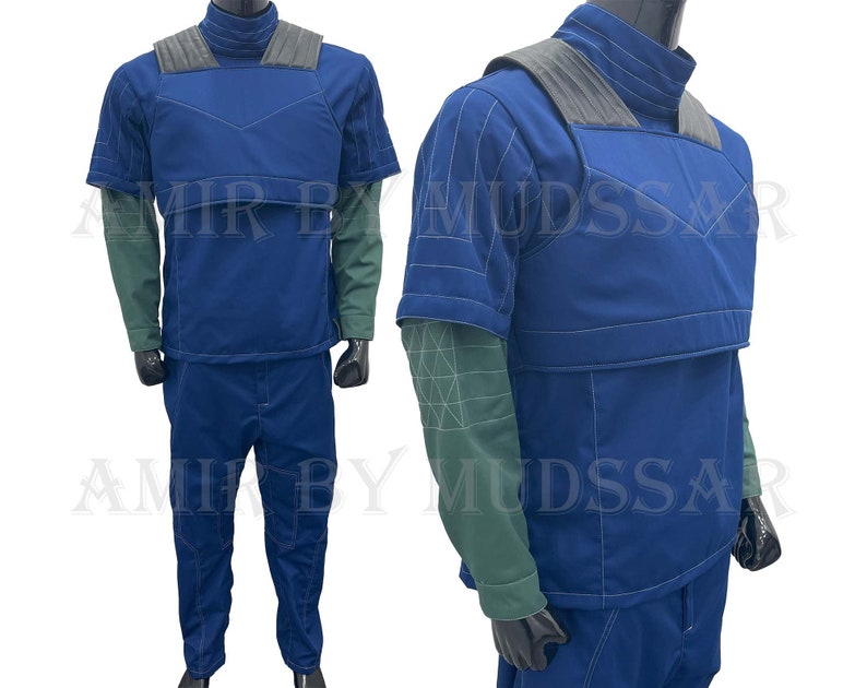 May include: A blue and gray jumpsuit with a high collar and short sleeves. The jumpsuit has a vest-like top with a zipper closure and a belt.