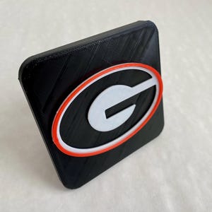 UGA University of Georgia Bulldogs Dawgs Tow Hitch Cover/Plug/Cap for 2&quot; & 1.25&quot; Receivers - Red/Black