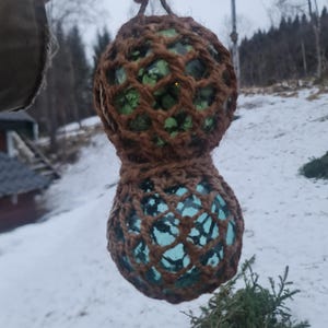 Small BØYEKAVL consisting of two glass fishing floats in the same net. Duo of a green and a aqua norwegian vintage working floats. Maked f.