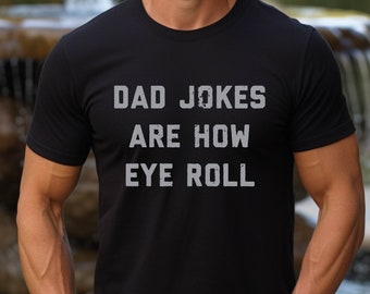 May include: Black t-shirt with the text "Dad Jokes Are How Eye Roll" in white.