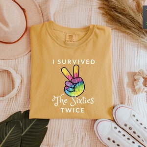 a t - shirt that says i survived the sixties twice