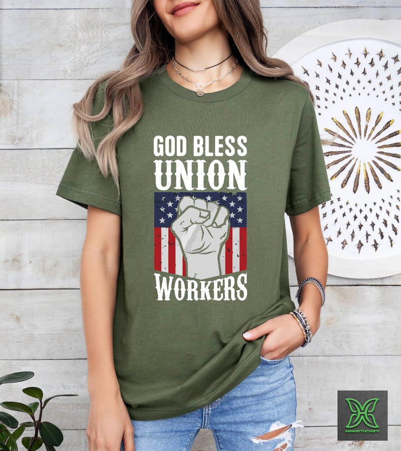 a woman wearing a t - shirt that says god bless union workers